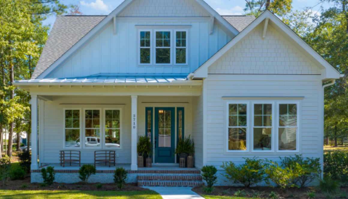 exterior of a home in the River Bluffs community with white siding and front porch