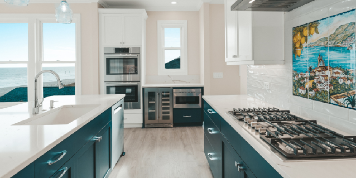 luxury coastal kitchen with blue cabinetry and white countertops